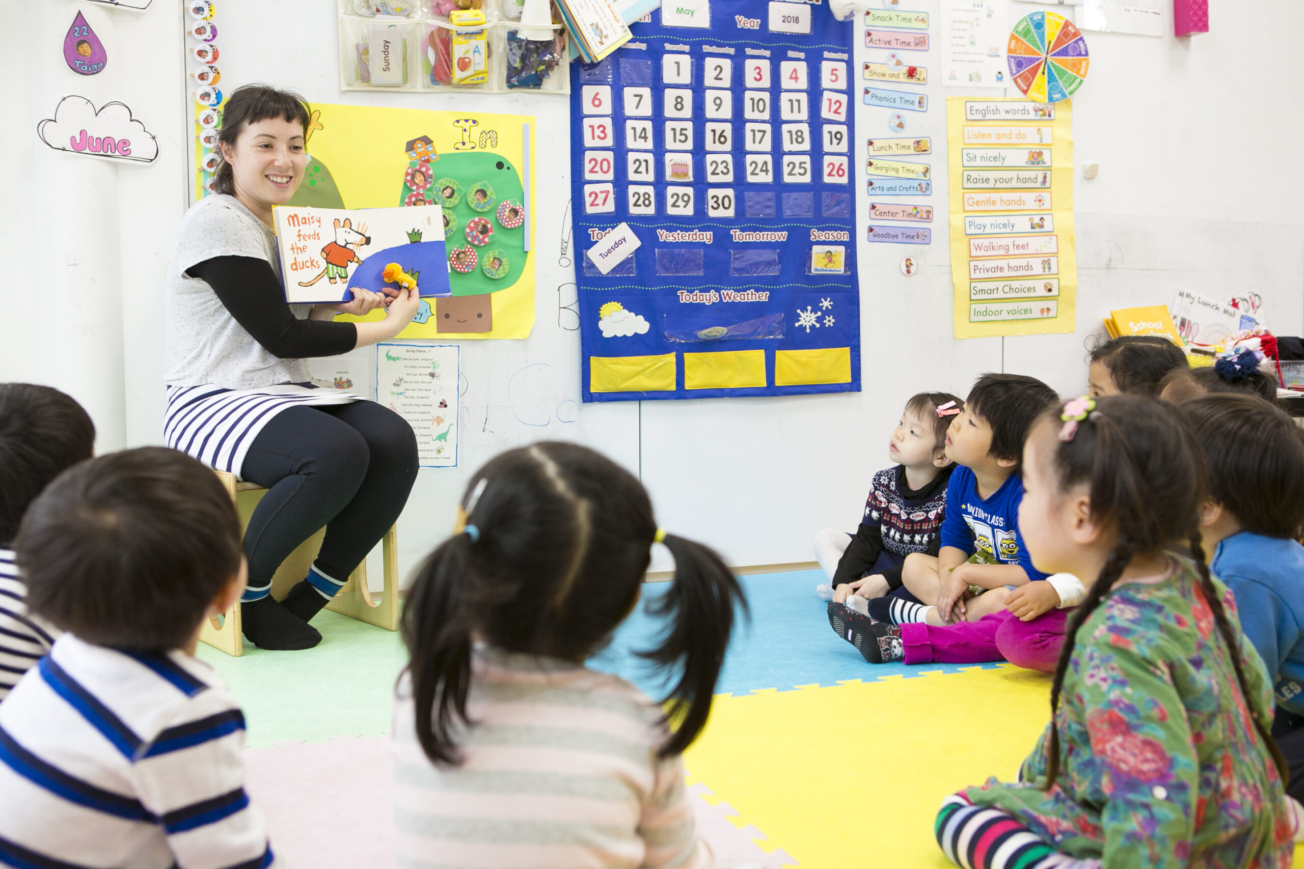 TISG students having fun during their story time class with their teacher