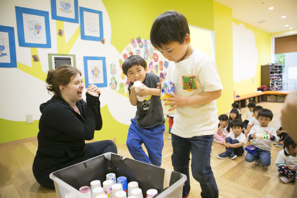 TISG students having fun with their teacher during class